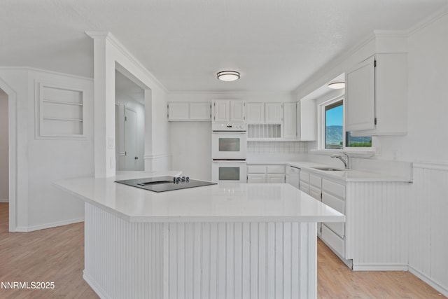 1314 Johnson Ln, Minden, NV 89423 - kitchen featuring white appliances, light wood-style floors, light countertops, and white cabinets