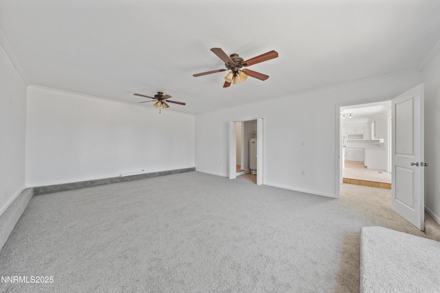1314 Johnson Ln, Minden, NV 89423 - unfurnished living room featuring crown molding, carpet, a ceiling fan, and washer / clothes dryer