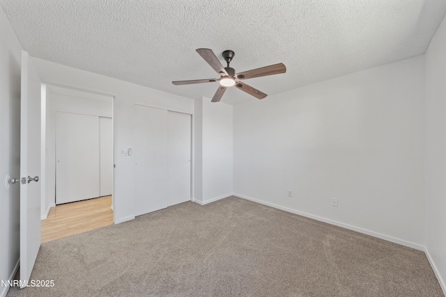 1314 Johnson Ln, Minden, NV 89423 - unfurnished bedroom featuring carpet flooring, a closet, a textured ceiling, and a ceiling fan