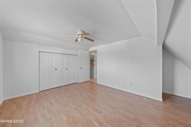 1314 Johnson Ln, Minden, NV 89423 - unfurnished bedroom with light wood finished floors, vaulted ceiling, a closet, and a ceiling fan