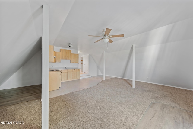 1314 Johnson Ln, Minden, NV 89423 - unfurnished living room featuring ceiling fan, lofted ceiling, and light colored carpet