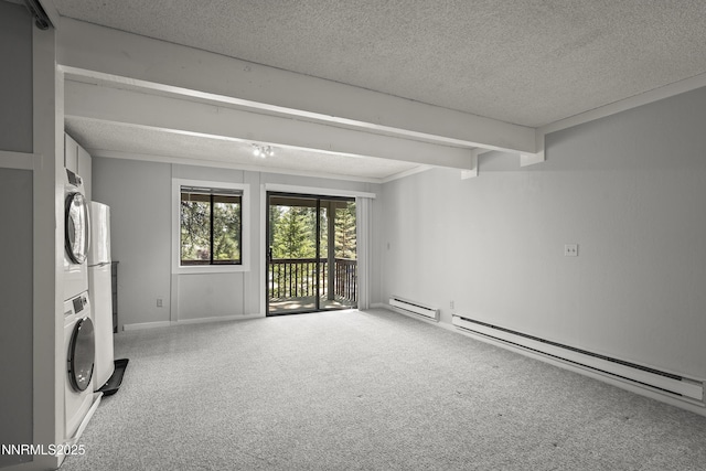 989 Tahoe Blvd Unit 71, Incline Village, NV 89451 - carpeted spare room featuring stacked washer and clothes dryer, a textured ceiling, a baseboard radiator, and baseboard heating