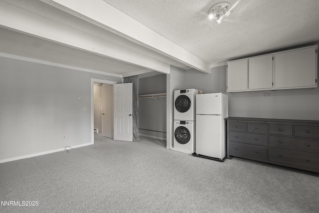 989 Tahoe Blvd Unit 71, Incline Village, NV 89451 - laundry area featuring stacked washer / dryer, a textured ceiling, and light carpet