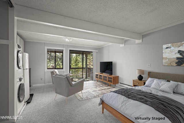 989 Tahoe Blvd Unit 71, Incline Village, NV 89451 - bedroom featuring stacked washer / drying machine, a textured ceiling, access to exterior, light colored carpet, and baseboard heating