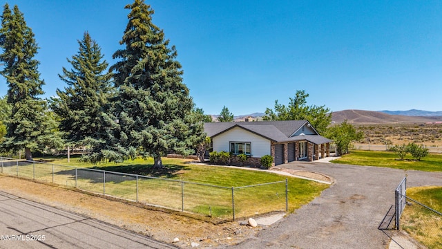 1513 S Riverview Dr, Gardnerville, NV 89460 - ranch-style house with a garage, driveway, and a mountain view