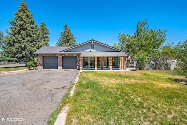 1513 S Riverview Dr, Gardnerville, NV 89460 - view of front of house featuring an attached garage, brick siding, asphalt driveway, and a porch