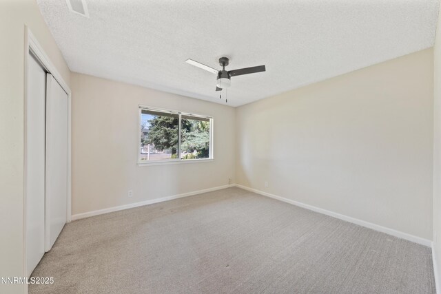 1513 S Riverview Dr, Gardnerville, NV 89460 - unfurnished bedroom with a closet, carpet floors, a textured ceiling, and ceiling fan
