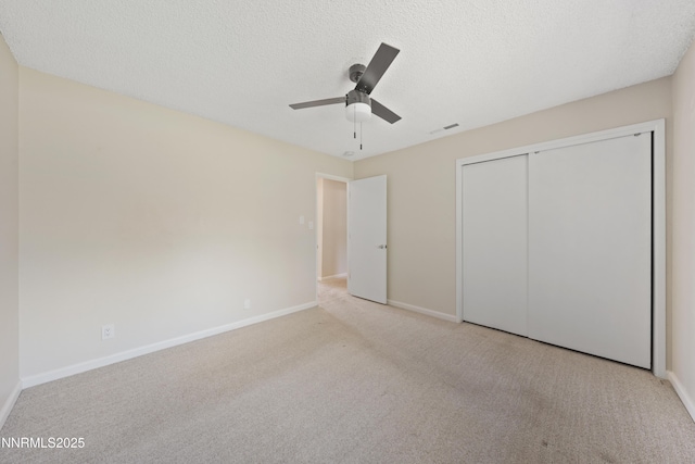 1513 S Riverview Dr, Gardnerville, NV 89460 - unfurnished bedroom featuring carpet flooring, a textured ceiling, a ceiling fan, and a closet