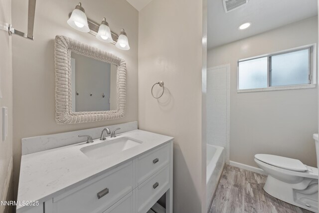 1513 S Riverview Dr, Gardnerville, NV 89460 - full bathroom featuring wood finished floors and vanity