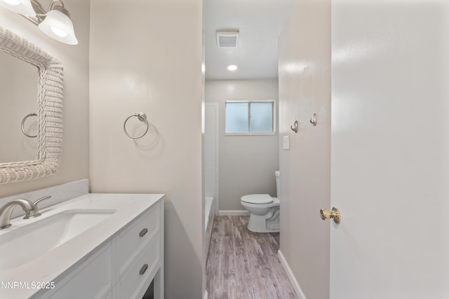 1513 S Riverview Dr, Gardnerville, NV 89460 - bathroom featuring vanity, wood finished floors, and shower / bath combination