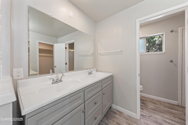 1513 S Riverview Dr, Gardnerville, NV 89460 - bathroom featuring wood finished floors and double vanity