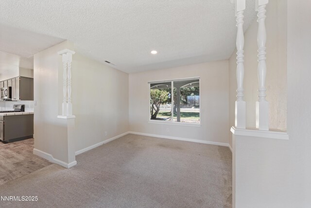 1513 S Riverview Dr, Gardnerville, NV 89460 - unfurnished room featuring light carpet, a textured ceiling, and recessed lighting