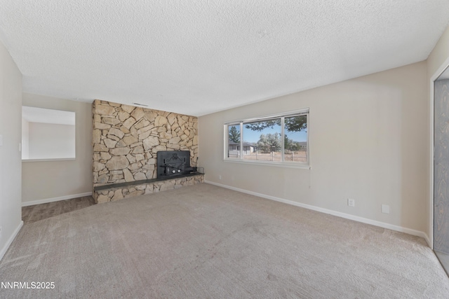 1513 S Riverview Dr, Gardnerville, NV 89460 - unfurnished living room with a textured ceiling, carpet flooring, and a stone fireplace