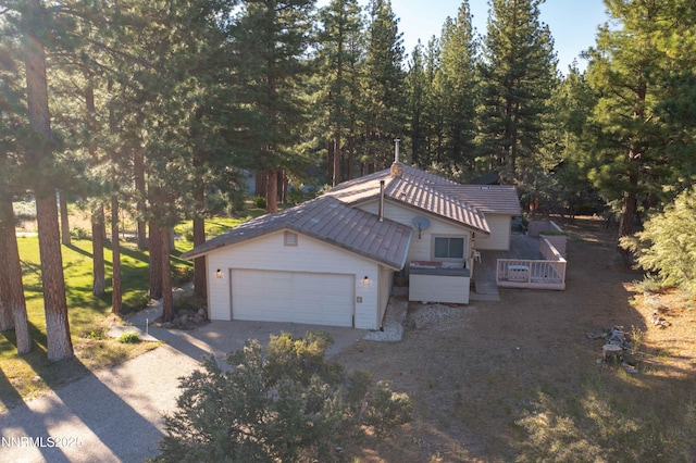25 Yellow Pine Cir, Reno, NV 89511 - view of front facade featuring concrete driveway, a garage, and a deck