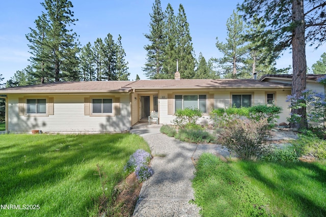 25 Yellow Pine Cir, Reno, NV 89511 - single story home with a front lawn and a chimney