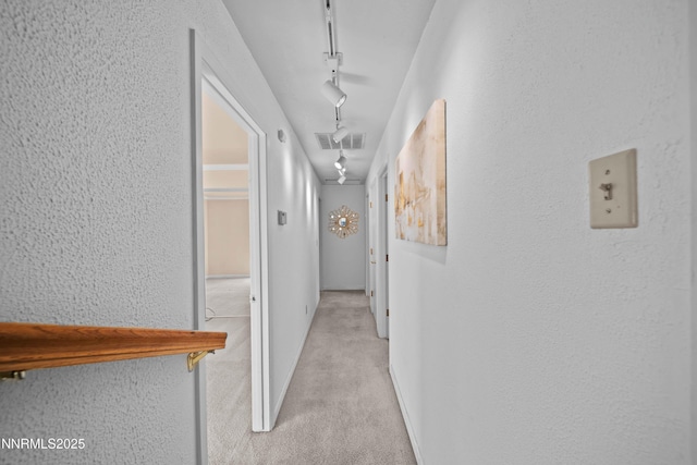 25 Yellow Pine Cir, Reno, NV 89511 - hall with light carpet, a textured wall, and track lighting