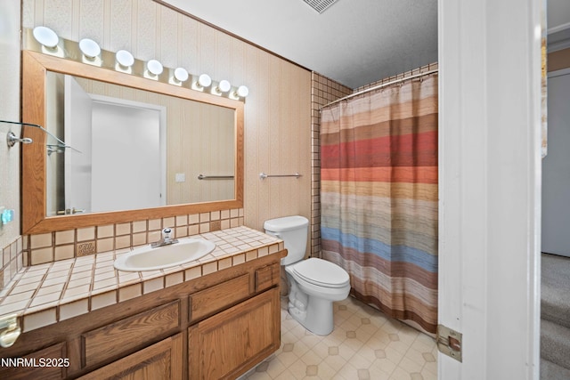 25 Yellow Pine Cir, Reno, NV 89511 - bathroom with vanity, tile patterned floors, backsplash, and a shower with curtain