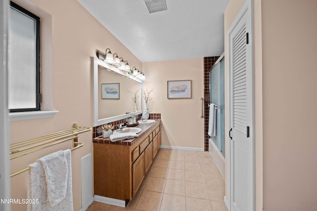 25 Yellow Pine Cir, Reno, NV 89511 - full bathroom featuring double vanity, tile patterned floors, and shower / bath combination with glass door