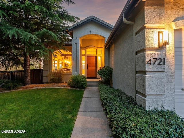 4721 W Creek Ridge Trl, Reno, NV 89519 - exterior entry at dusk with stucco siding