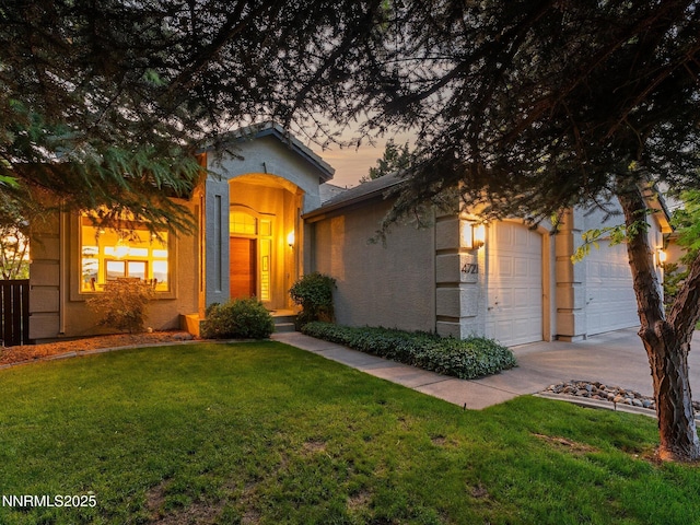 4721 W Creek Ridge Trl, Reno, NV 89519 - view of front of property featuring stucco siding, driveway, a front yard, and a garage