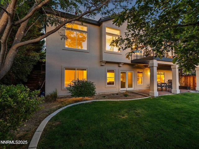 4721 W Creek Ridge Trl, Reno, NV 89519 - rear view of house featuring stucco siding, a balcony, and a patio