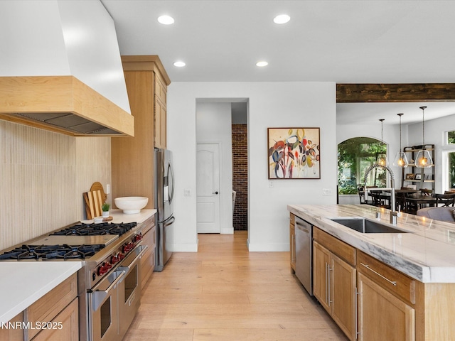 4721 W Creek Ridge Trl, Reno, NV 89519 - kitchen with premium range hood, appliances with stainless steel finishes, light wood finished floors, recessed lighting, and hanging light fixtures
