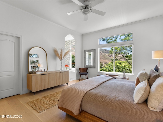 4721 W Creek Ridge Trl, Reno, NV 89519 - bedroom with light wood-style floors, ornamental molding, and a ceiling fan
