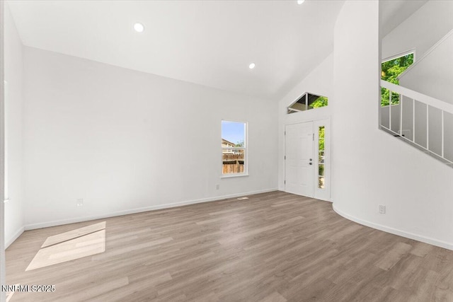 2719 Chavez Dr, Reno, NV 89502 - entryway featuring wood finished floors, high vaulted ceiling, and recessed lighting