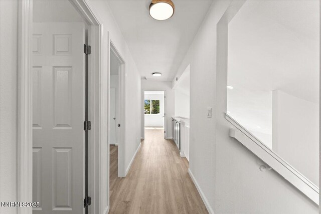 2719 Chavez Dr, Reno, NV 89502 - corridor with light wood-style flooring and baseboards