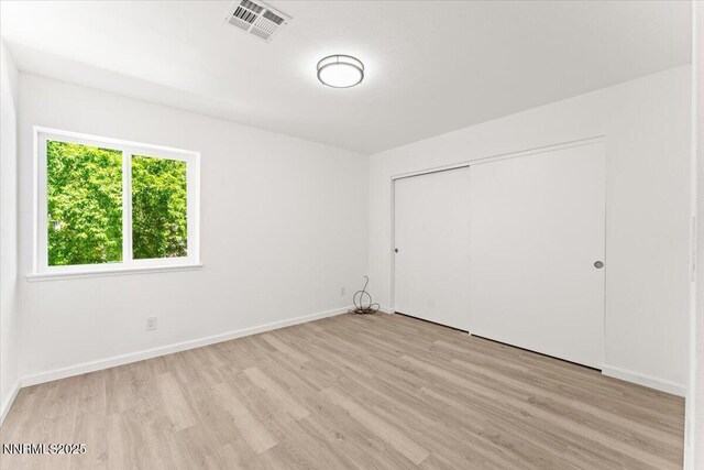 2719 Chavez Dr, Reno, NV 89502 - unfurnished bedroom featuring light wood-style floors and a closet