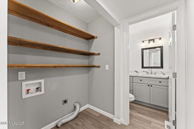 2719 Chavez Dr, Reno, NV 89502 - laundry room with hookup for an electric dryer, light wood-style floors, and hookup for a washing machine