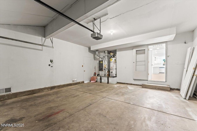 2719 Chavez Dr, Reno, NV 89502 - garage featuring a garage door opener and secured water heater