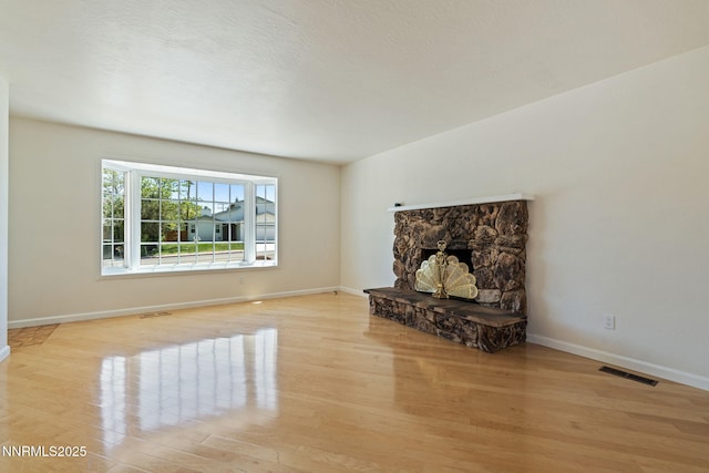 2095 Kings Row, Reno, NV 89503 - unfurnished living room with light wood-type flooring and a fireplace