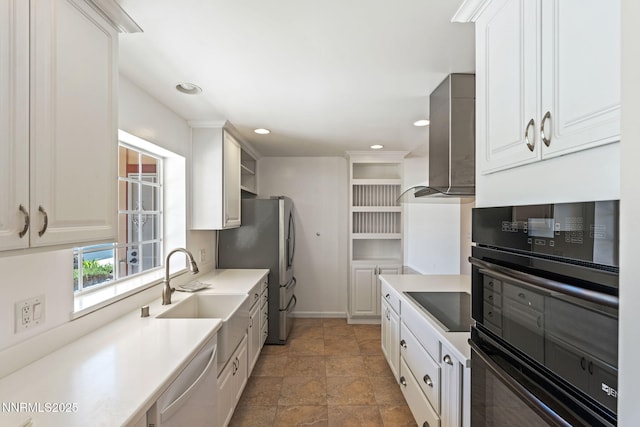 2095 Kings Row, Reno, NV 89503 - kitchen featuring black appliances, stone finish floors, wall chimney exhaust hood, recessed lighting, and white cabinets