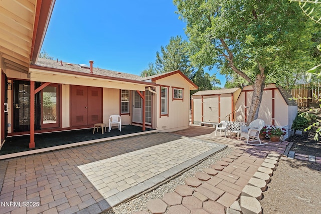 2095 Kings Row, Reno, NV 89503 - rear view of house featuring a storage unit and a patio area