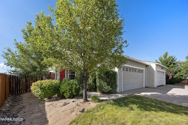 8733 Sunset Breeze Dr, Reno, NV 89506 - obstructed view of property featuring driveway and a garage