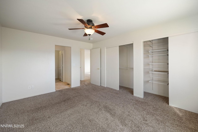 8733 Sunset Breeze Dr, Reno, NV 89506 - unfurnished bedroom featuring multiple closets, carpet flooring, and a ceiling fan