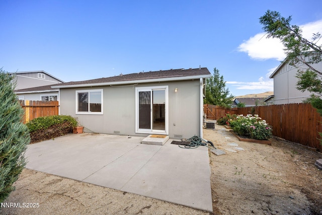 8733 Sunset Breeze Dr, Reno, NV 89506 - back of house with a fenced backyard and a patio area