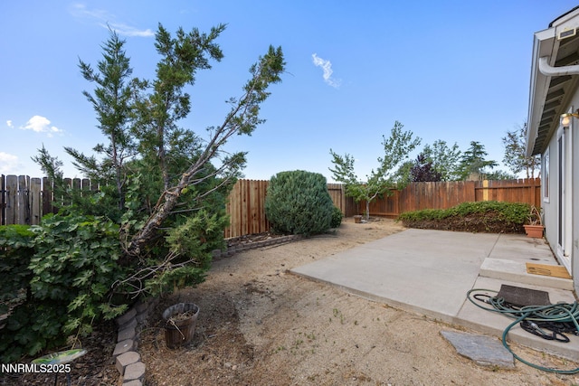 8733 Sunset Breeze Dr, Reno, NV 89506 - fenced backyard featuring a patio