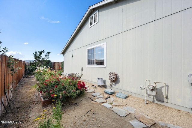 8733 Sunset Breeze Dr, Reno, NV 89506 - view of side of home with a fenced backyard