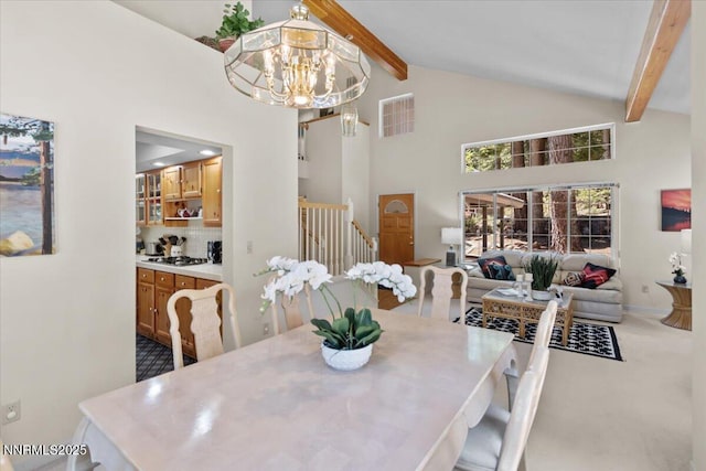 917 Jennifer St, Incline Village, NV 89451 - dining area featuring a chandelier, beamed ceiling, stairway, and high vaulted ceiling
