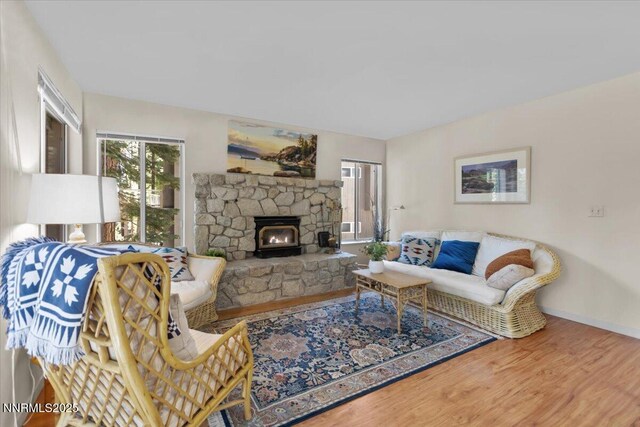 917 Jennifer St, Incline Village, NV 89451 - living room featuring wood finished floors and a stone fireplace