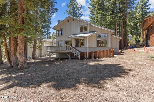 917 Jennifer St, Incline Village, NV 89451 - back of property featuring a deck, a chimney, and board and batten siding