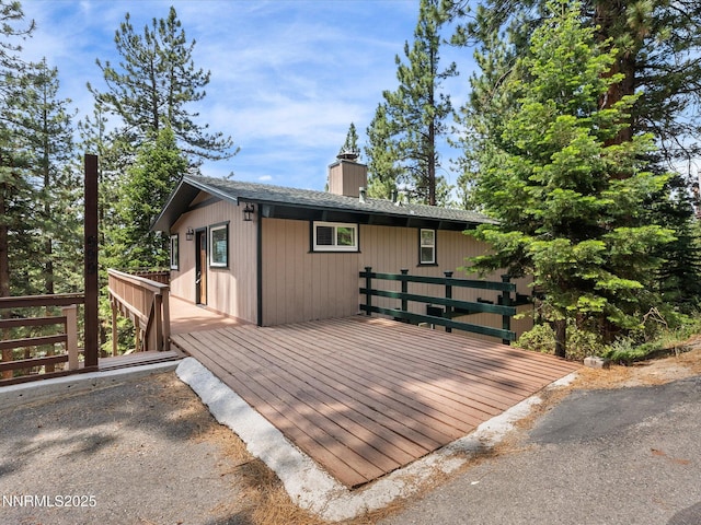 699 Lakeview Dr, Zephyr Cove, NV 89448 - view of front facade featuring a deck and a chimney