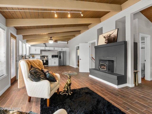 699 Lakeview Dr, Zephyr Cove, NV 89448 - living room featuring wooden ceiling, wood finished floors, a ceiling fan, track lighting, and a lit fireplace