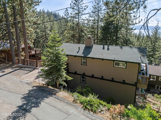 699 Lakeview Dr, Zephyr Cove, NV 89448 - view of front of home with roof with shingles and a chimney