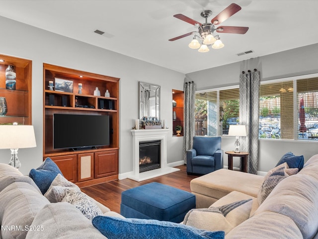1486 Lambrays Ct, Sparks, NV 89436 - living area featuring ceiling fan, dark wood-style floors, and a glass covered fireplace
