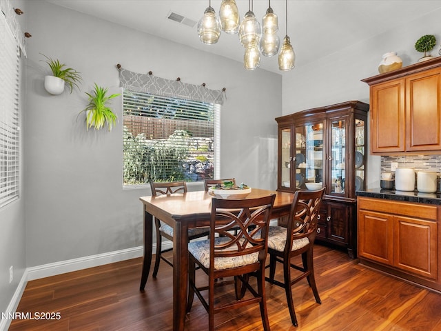 1486 Lambrays Ct, Sparks, NV 89436 - dining area with dark wood finished floors and baseboards