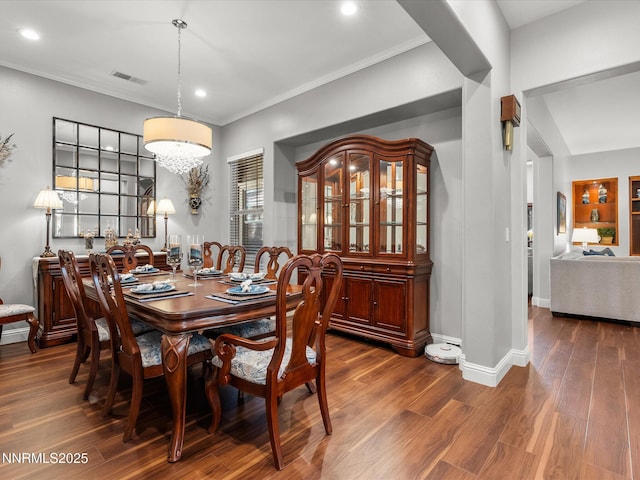 1486 Lambrays Ct, Sparks, NV 89436 - dining space with dark wood-type flooring, crown molding, and recessed lighting