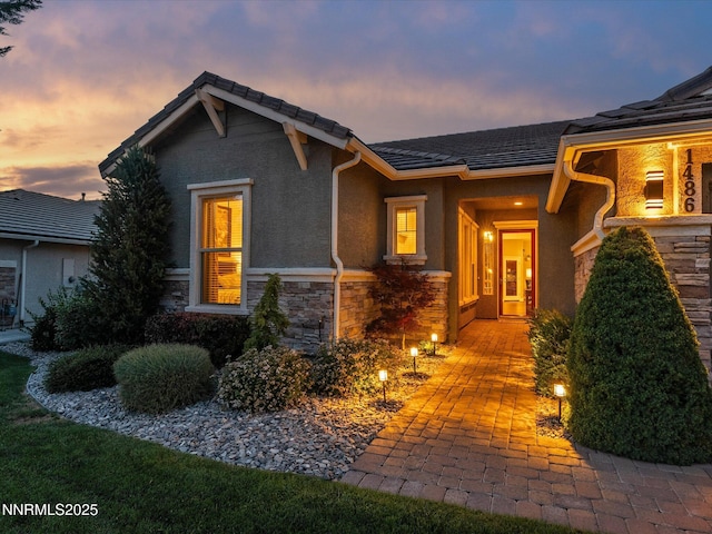 1486 Lambrays Ct, Sparks, NV 89436 - view of front of house featuring stone siding, stucco siding, and a tile roof